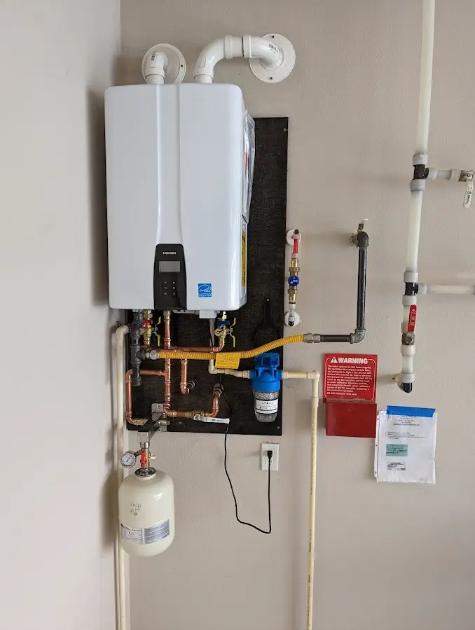 Professional plumber installing copper piping in a Sellersburg home